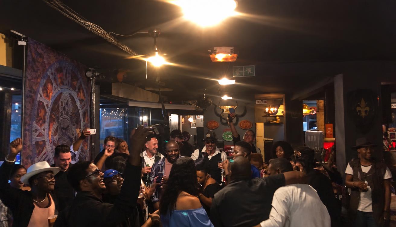 A full dance floor at a live music venue