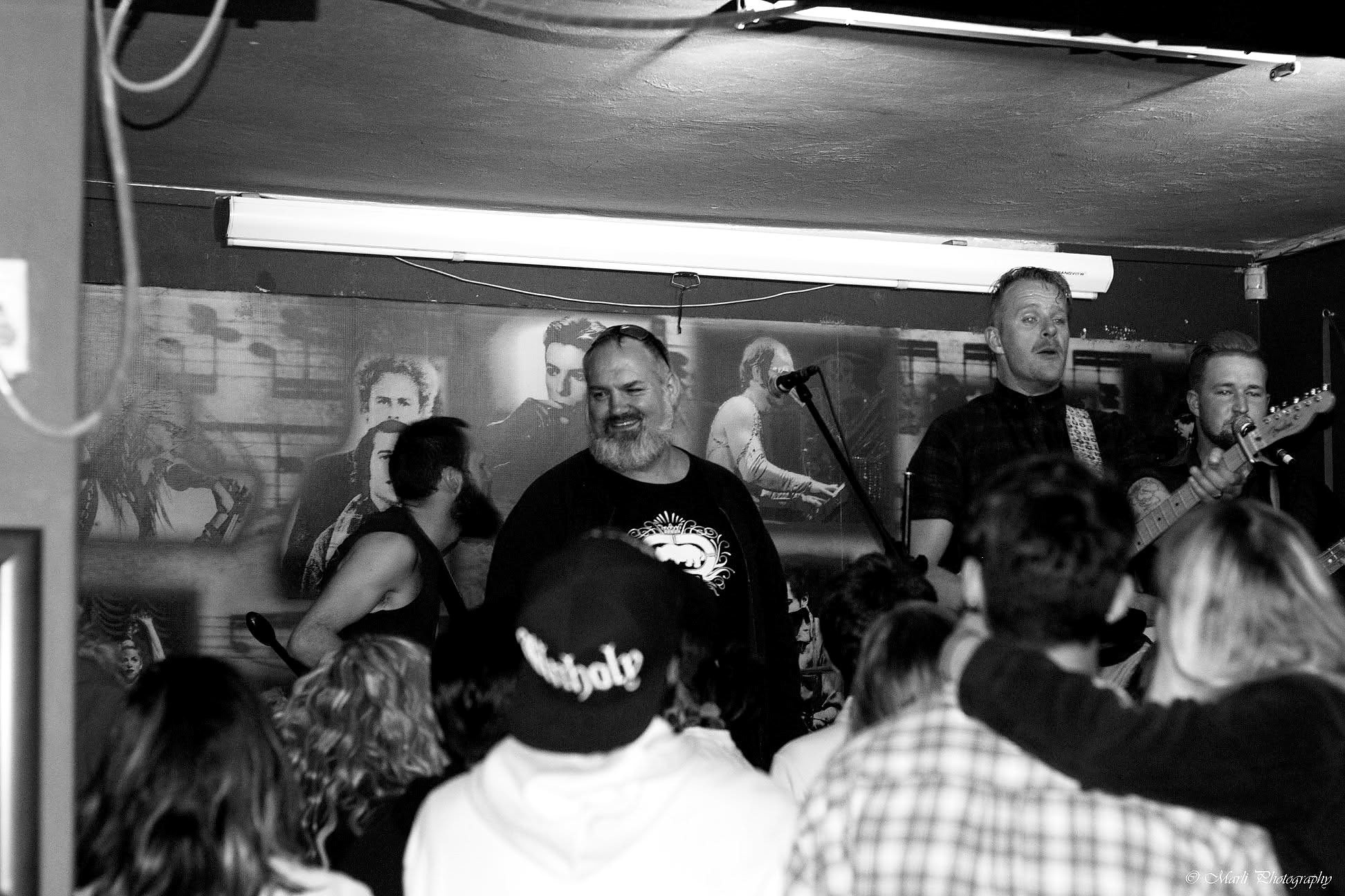 Crowd enjoying a brightly lit stage